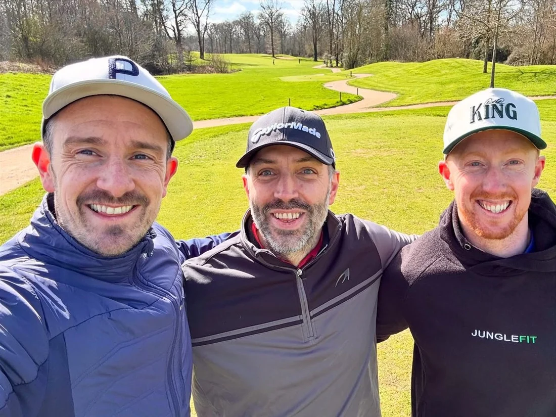 Three JungleFit members taking a selfie on a golf course