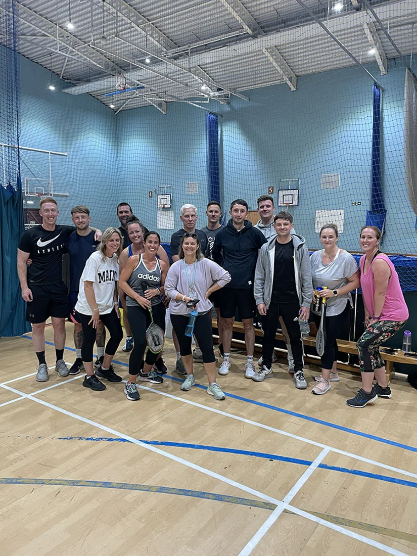 A JungleFit group in a sports hall at a social sports night